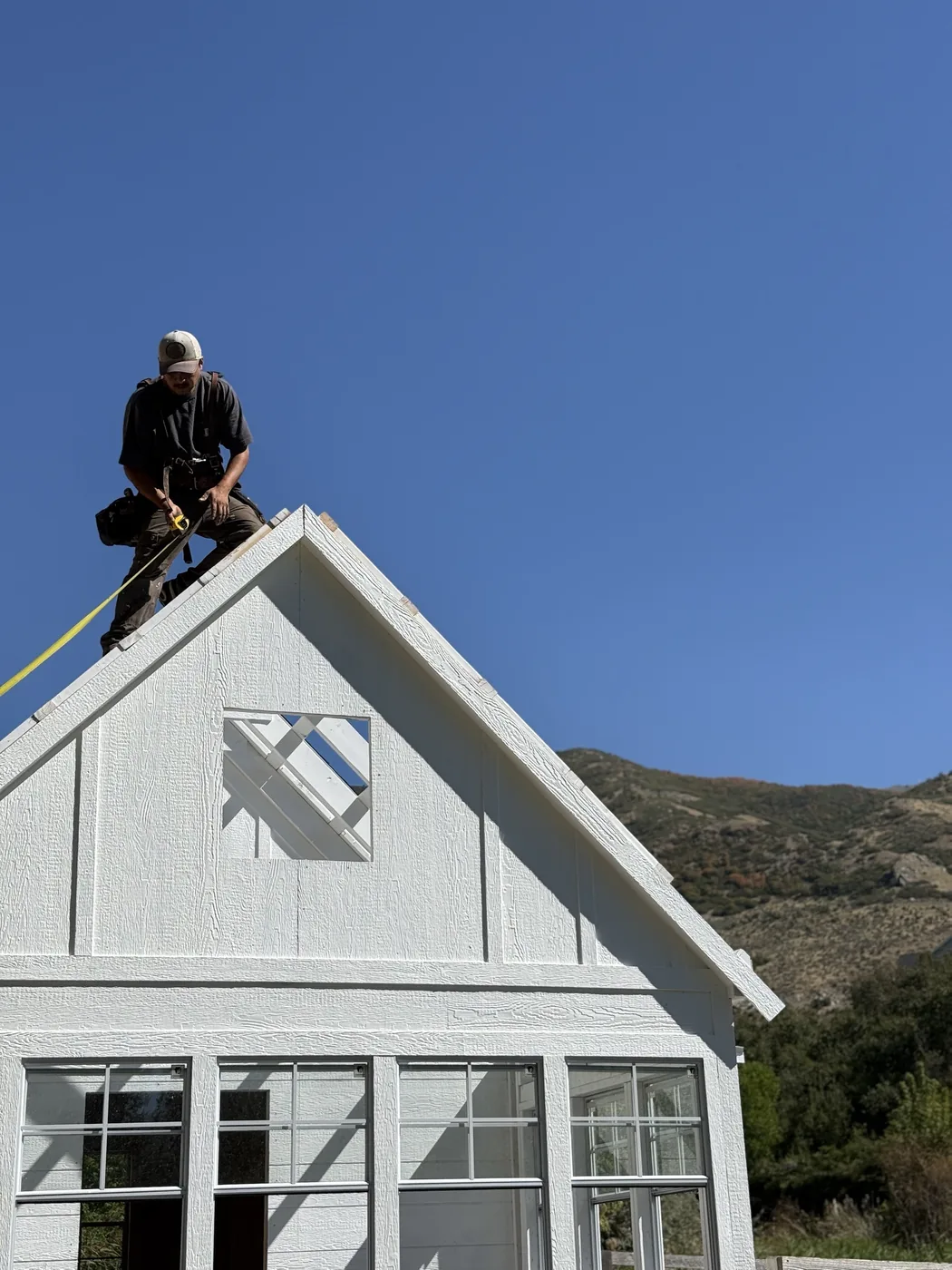 ShedPro crew framing a gable wall with a window opening on-site