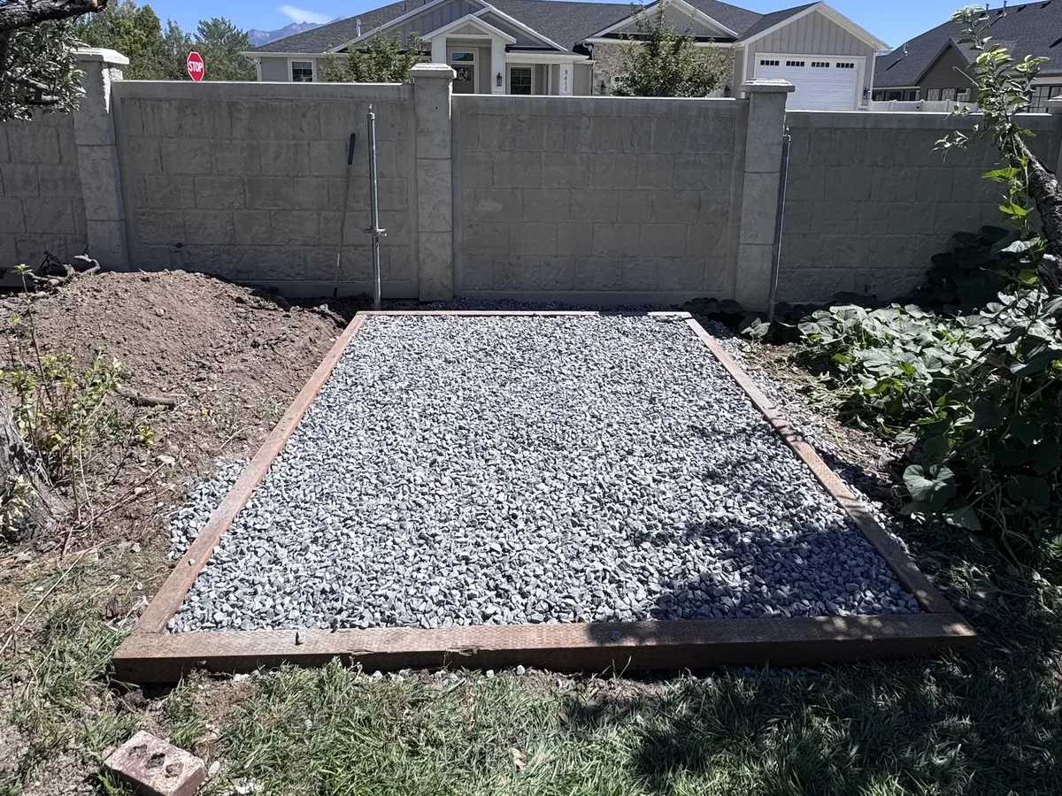 Crushed gravel shed pad boxed in with treated timber, built by ShedPro LLC in Utah