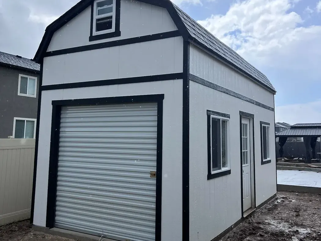 Barn style shed with garage door by ShedPro LLC